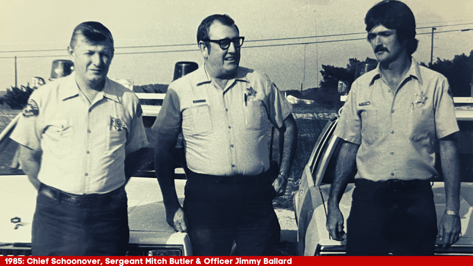 1985 photo of Chief Schoonover, Sergeant Mitch Butler, and Officer Jimmy Ballard standing in front o